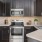 a kitchen with black cabinets