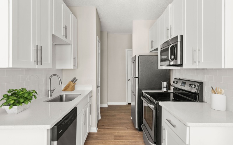 a kitchen with whit cabinets