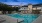a swimming pool in front of a building