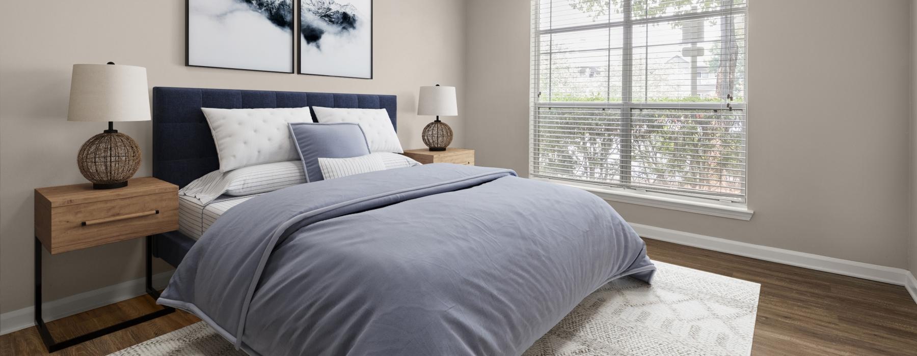 a bedroom with a bed and lamps