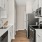 a kitchen with white cabinets