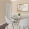 a dining room with a table and chairs