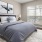 a bedroom with a bed and lamps