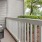 a white porch with a bench and a chair