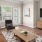 a living room with a tv and couches