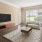 a living room with a tv and couches
