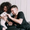 woman and man petting dog