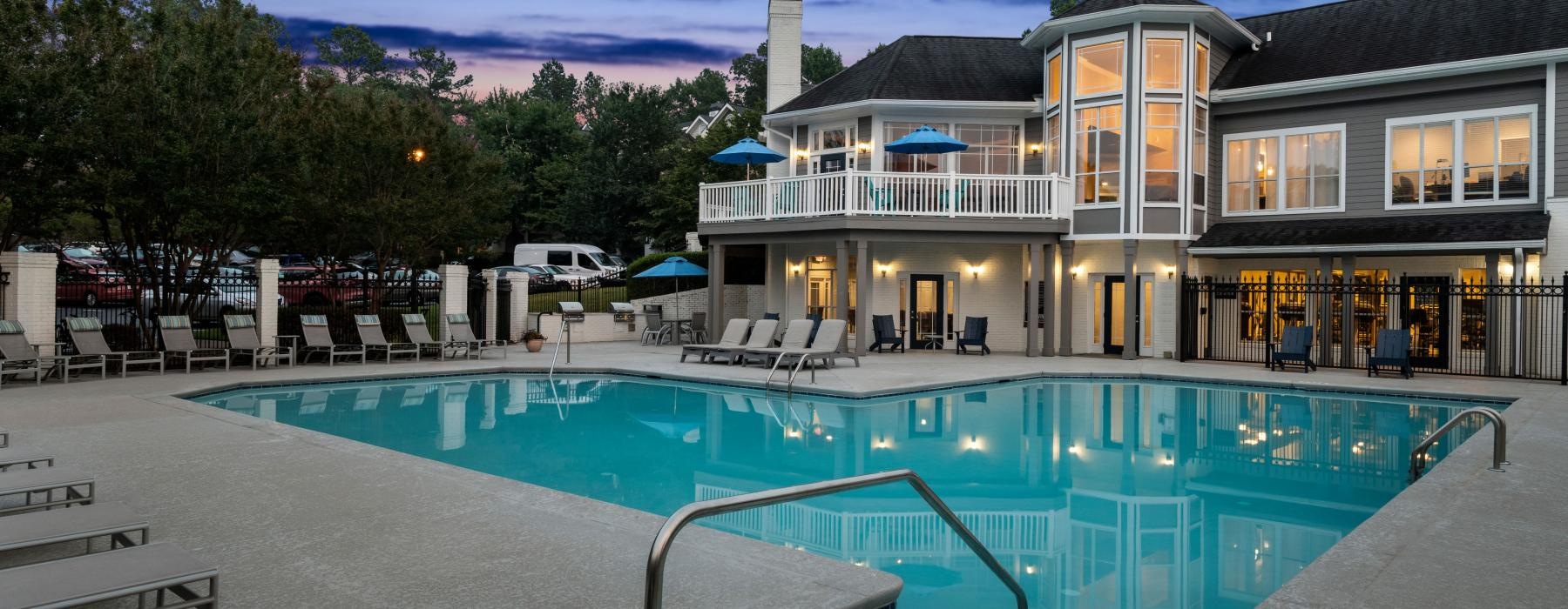 a swimming pool in front of a building
